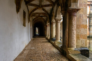 Fototapeta na wymiar Cloister Stone Walkway, With Columns And Vaulted Ceiling. Tomar, Portugal 