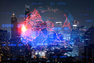 Hologram of Earth planet map on night panoramic cityscape of Bangkok, Asia. The concept of international companies. Multi Exposure.