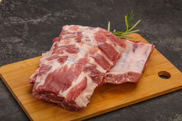 Raw pork ribs served rosemary