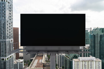 Blank black road billboard with Singapore cityscape background at day time. Street advertising poster, mock up, 3D rendering. Front view. The concept of marketing communication to promote.