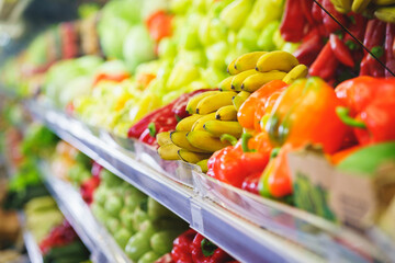 Bunch of ripe yellow bananas on the counter in the supermarket.