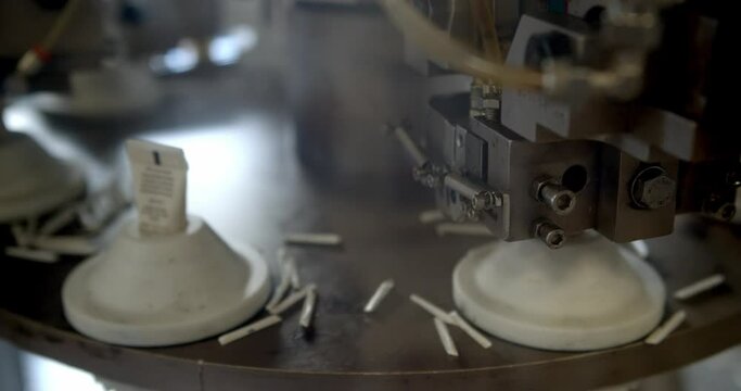Cosmetic Manufacturing Industry - A Cosmetic Tube Creams Being Sealed On The Automatic Machine. - close up shot