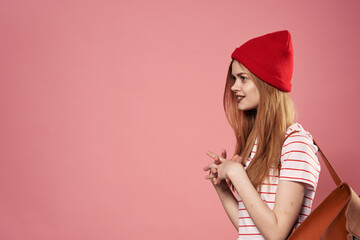 Pretty woman in red hat photo emotions joy pink background