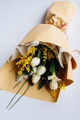 Bouquet of flowers in beige package