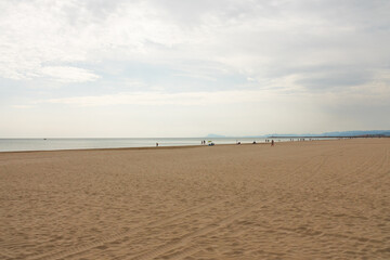 Beautiful longshot photography of a sand beach. Not crowded because of the Coronavirus crisis.