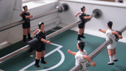 Top Down View Close-Up on Fooseball Table Players on Black Team