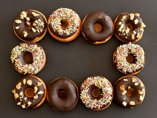 Delicious chocolate donuts  isolated on a black background.