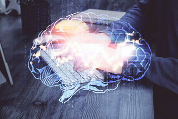 Man with computer background with brain theme hologram. Concept of brainstorm. Double exposure.