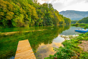 Blue Eye water spring with clear blue water summer view