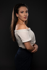 Beautiful girl posing in studio on grey background. Isolated