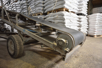 Fototapeta na wymiar Conveyor belt in the warehouse for moving cargo