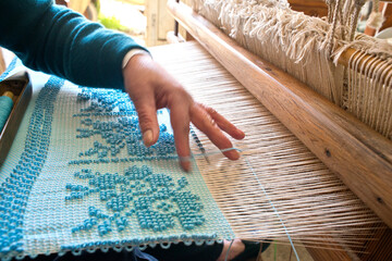 Carpet loom, weaver,  Laconi, Oristano, Sardinia, Italy