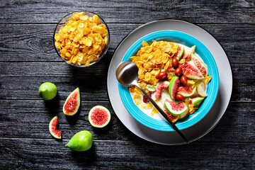 Healthy breakfast: yogurt, corn flakes, figs, pear