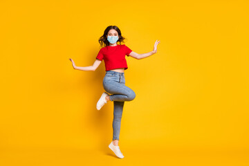 Fototapeta na wymiar Full size photo of girl jump wear red clothes footwear wear mask isolated over shine color background