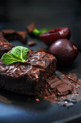 Homemade Fudge Brownie with Chocolate on Dark Background