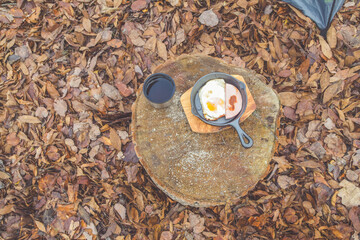 a hot tea and scrambled eggs are served for Breakfast at the campsite