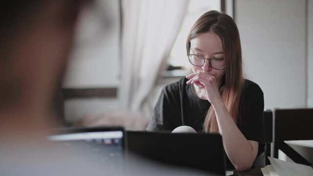 A Young Couple In Love Working Together On A Computer, Safely From Home.