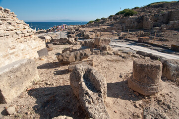 Obraz premium Tharros, Archeological area, Punic and Roman ruins and blue sea in Sardinia