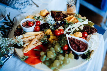 Plate of cheese snacks, totmatoes, vegetable, snack in restaurant