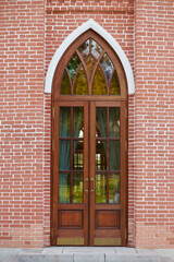 Antique door in the form of an arch with a pointed top