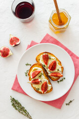 Bruschetta with figs, honey and cheese. Healthy eating. Vegetarian food.