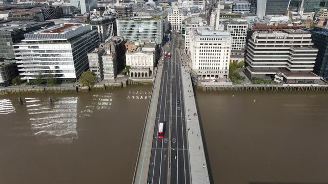 Stunning aerial view of London Bridge showcasing iconic buildings of the city with the thames river taken autumn 2020.