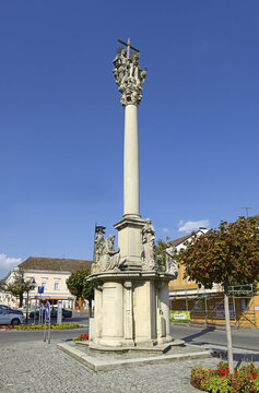 Bruck an der Leitha - The main square with a plague column on August 8, 2014. Bruck an der Leitha (Bridge upon Leitha river) it is an ancient walled city, located in Lower Austria.