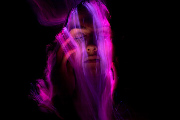 Abstract photography in the style of light painting. girl on a black background	
