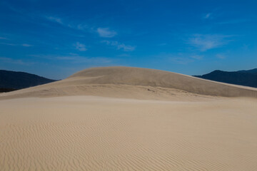 Fototapeta na wymiar joaquina sand dunes and sky in florianopolis