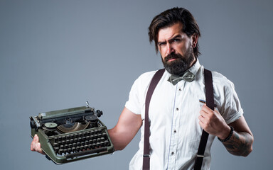 new technology. old technology in modern life. old fashioned bearded hipster. trendy man in bow tie use retro typewriter. confident and elegant man holding vintage equipment. literature and poetry