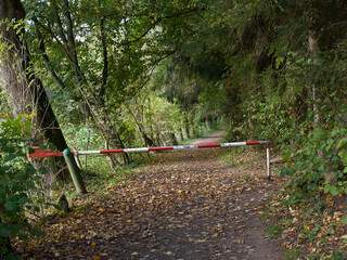 No entry to the forest. A barrier on a forest path on an autumn day in the German city of Ratingen in NRW.