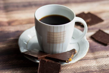 
Black coffee standing on the table with chocolate