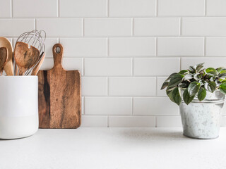 Kitchen background with kitchen utensils and houseplant - obrazy, fototapety, plakaty