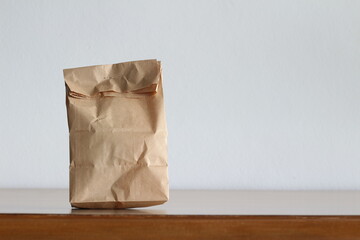 paper bag on wooden table background