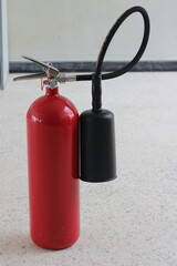 Obraz premium fire extinguisher container on wall in the building.