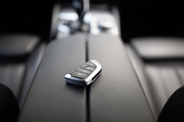 Car ignition key at the armrest rental car serice