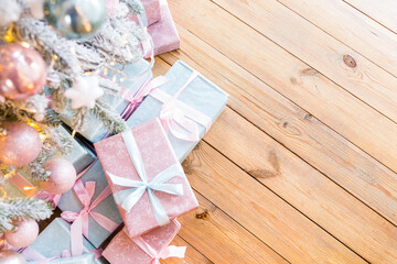 
Gift boxes on a wooden floor from top view with place for text.