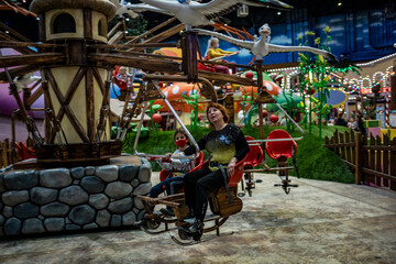 grandmother with her granddaughter at the children's entertainment center