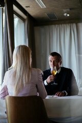 Handsome businessman drinking wine. Businessman enjoying in the restaurant..
