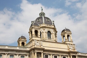 Fototapeta na wymiar Dome with a statue on a building in Vienna AUstria
