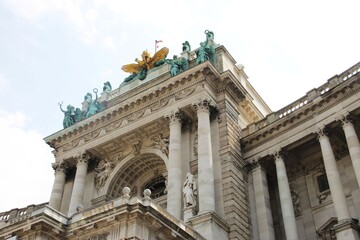 Fototapeta na wymiar Statues on a Hofburg castle in Vienna Austria