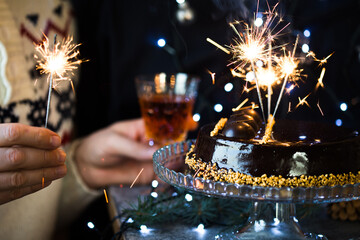 Chocolate Christmas Cake on dark background. Classic chocolate cake with dark chocolate and...