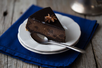 slice of Chocolate  Cake on dark background. Classic chocolate cake with dark chocolate 