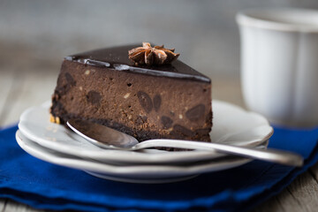 slice of Chocolate  Cake on dark background. Classic chocolate cake with dark chocolate 