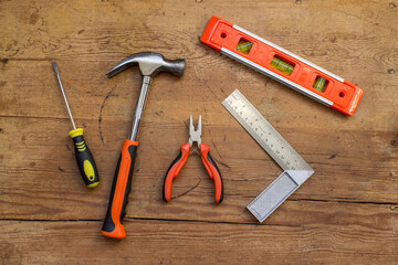 Orange tools on wooden surface 