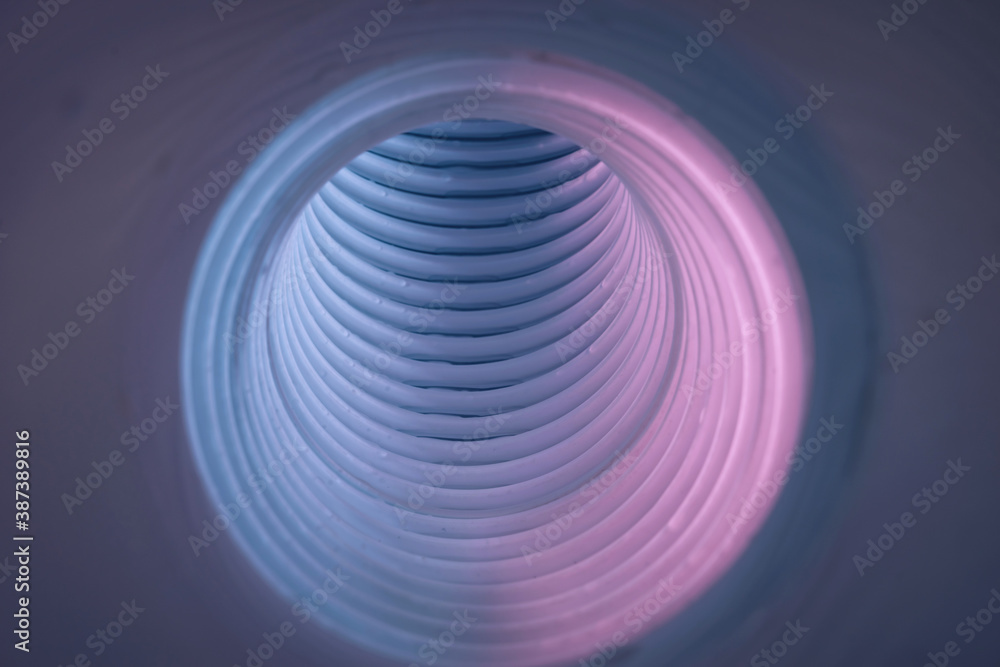 Poster beautiful round abstract white-gray tunnel with color light on a background pattern textured ford de