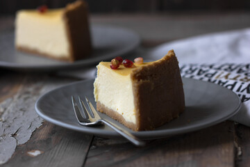 Cheesecake with berry on black background. Tasty homemade caramel cheesecake