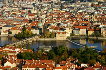 Fototapeta na wymiar View of Prague Old Town From Lesser Town. The photo shows Vltava river and Charles Bridge, St. Francis Of Assisi Church, Church of Our Lady before Tyn.