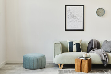 Stylish loft interior with green sofa, design pouf, mock up poster map, furniture,  carpet, plants,...