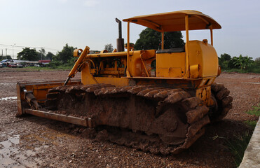 yellow bulldozer on the road